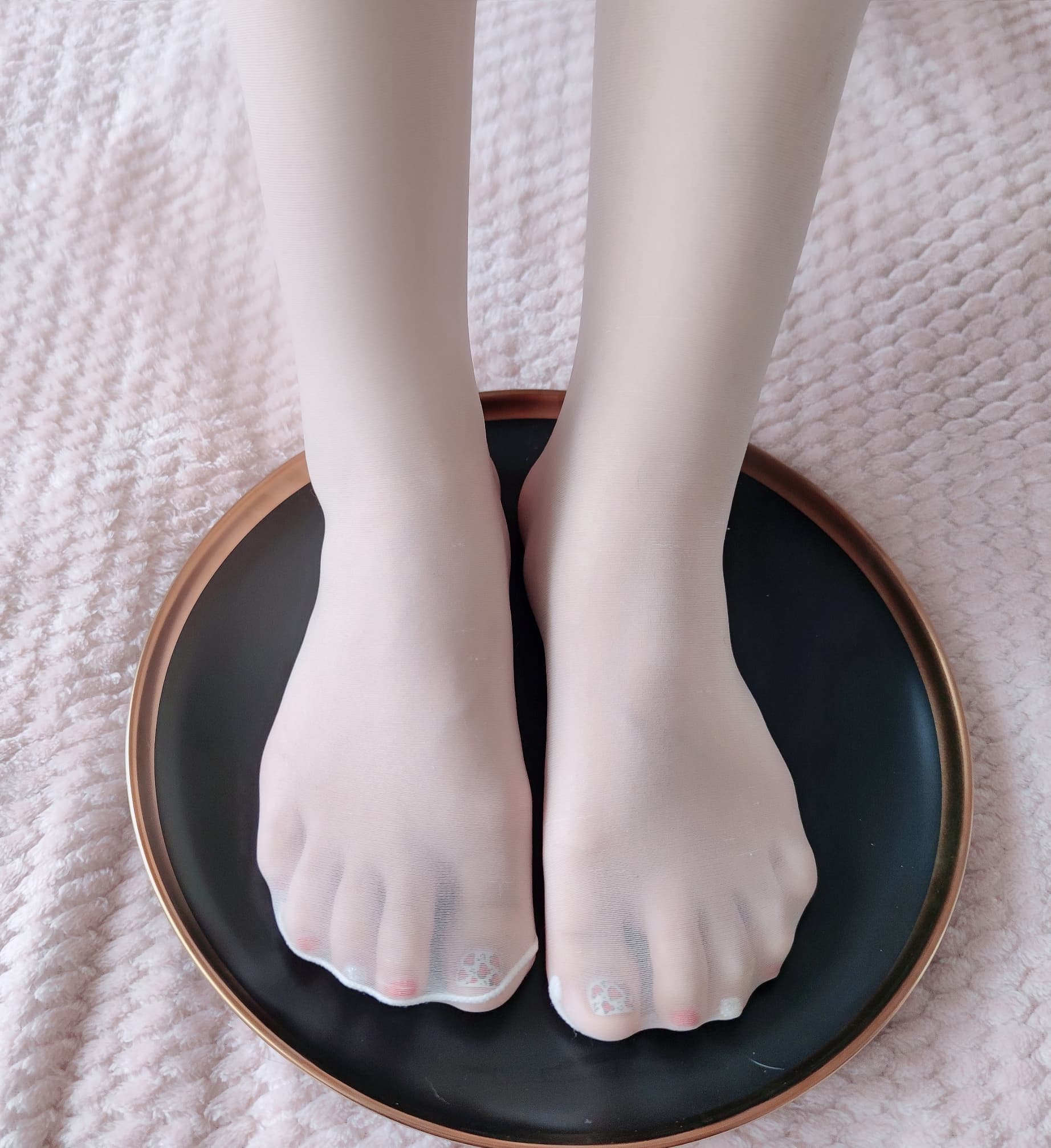 Glossy bare feet close-up